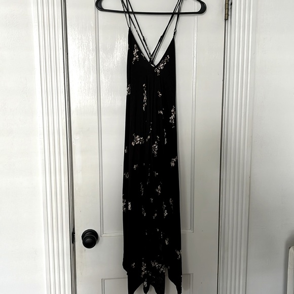Lovestitch black dress with adjustable cross straps and asymmetrical bottom. - Picture 1 of 3